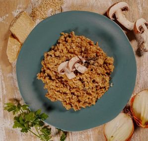 Organic wholemeal rice risotto with mushrooms